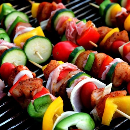 A vegetable kebab on a barbeque. 